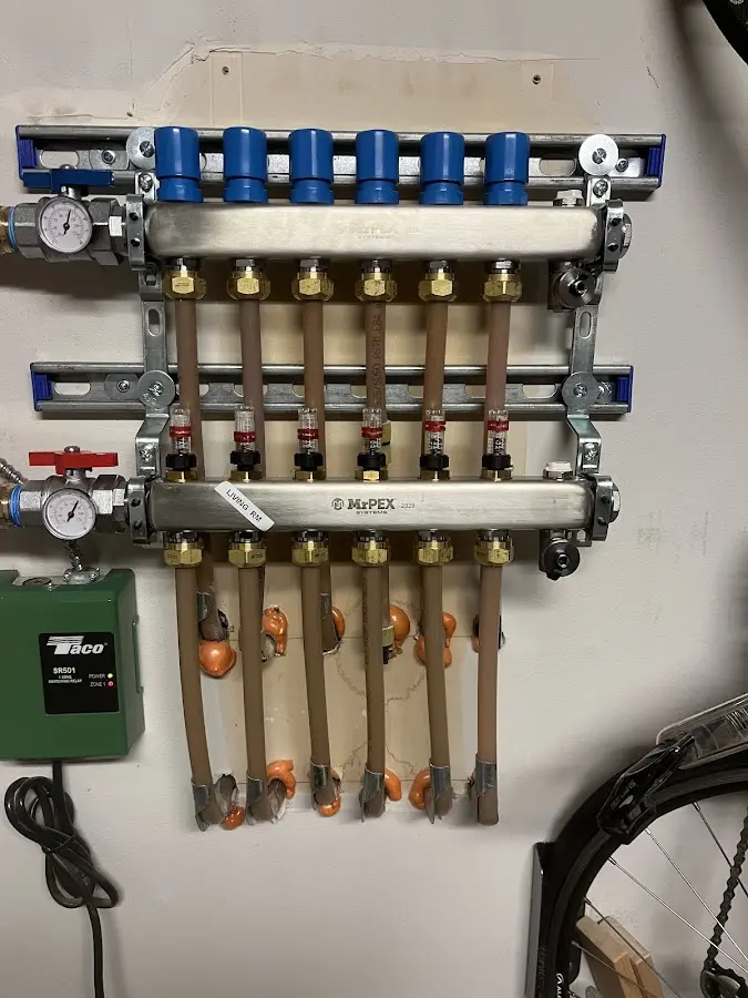 Plumber performing Water Heater Repair at a residential property in Clayton